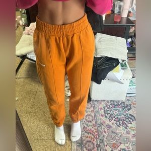Orange Nike joggers